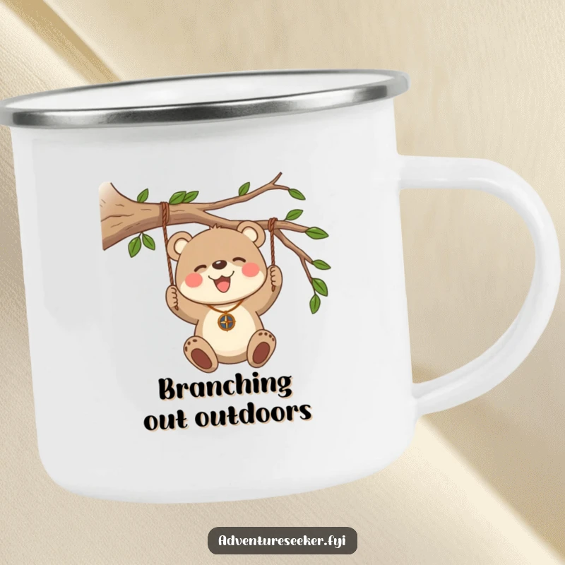 Funny Bear Cub Compass Camping Mug. Features a bear cub swinging from a branch with a compass for outdoor adventures.