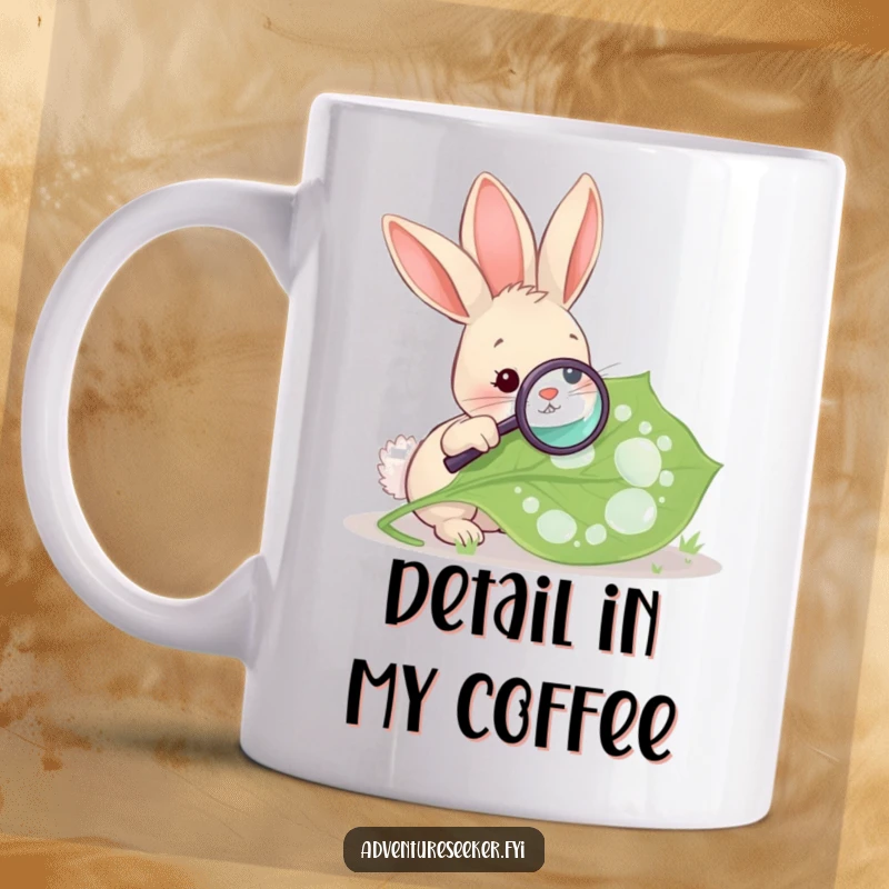 Funny Rabbit Magnifying Leaf Mug. A curious rabbit uses a magnifying glass to examine a large, dewy leaf.
