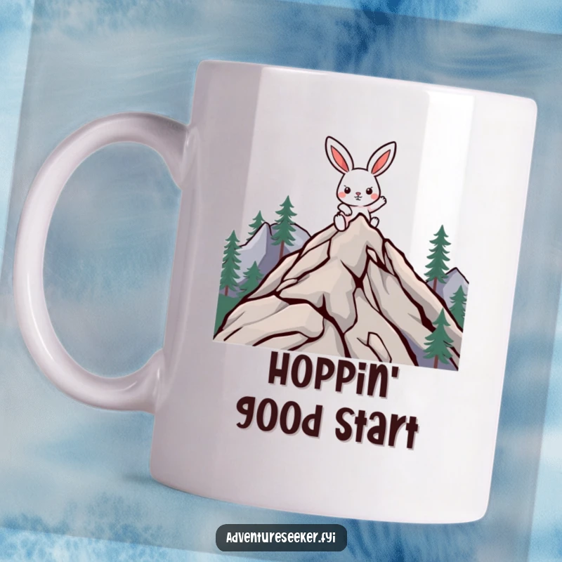 Funny climbing rabbit mug with a determined character scaling a mountain peak, symbolizing perseverance and humor.