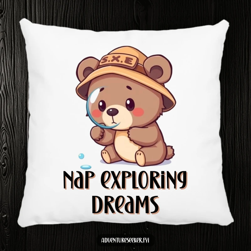 Funny bear cub explorer pillow, showing a focused cub in an explorer hat examining a dewdrop with a magnifying glass.
