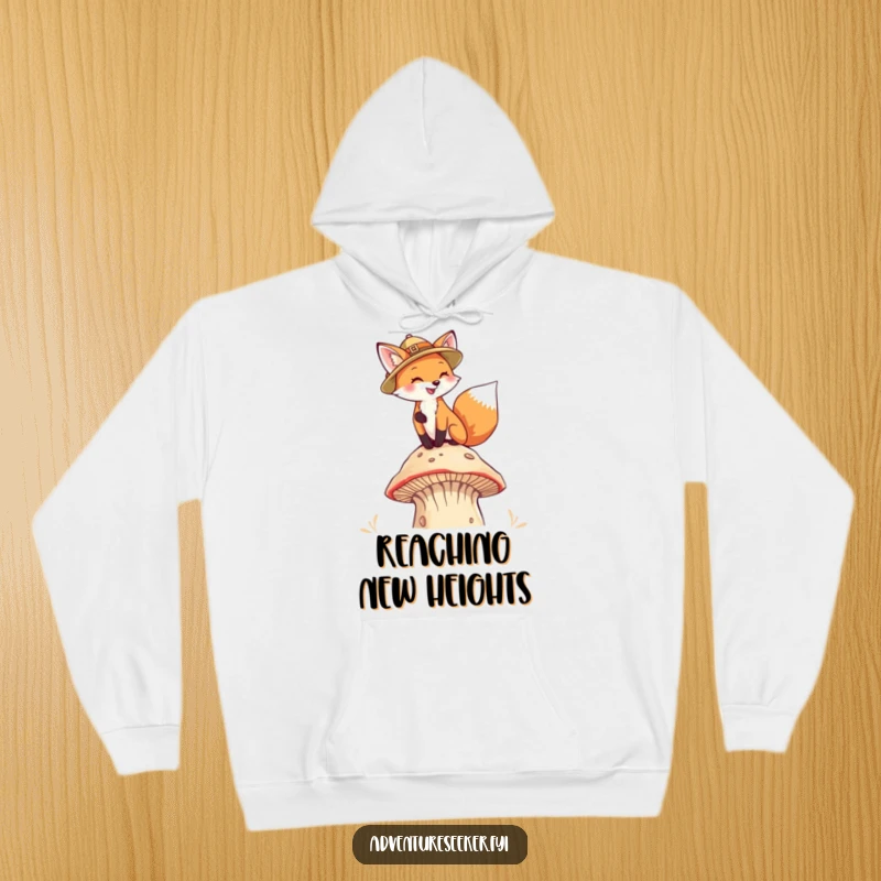 Funny Fox Pith Helmet Hoodie. A fox in a pith helmet climbs a mushroom, offering warmth and whimsical adventure.