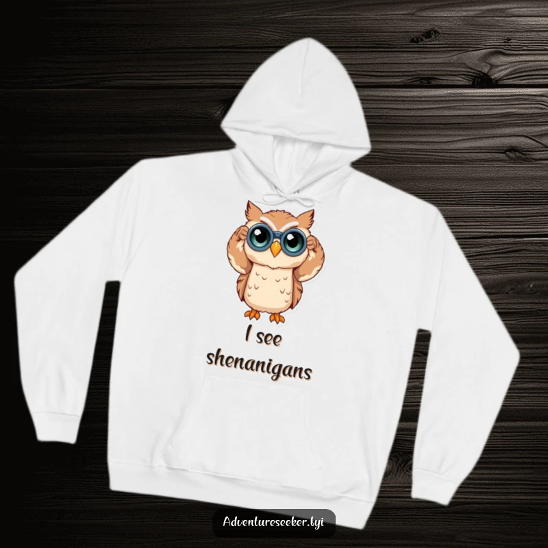 Funny owl character in a hoodie, using binoculars to observe the world, conveying curiosity. Ideal funny gift.