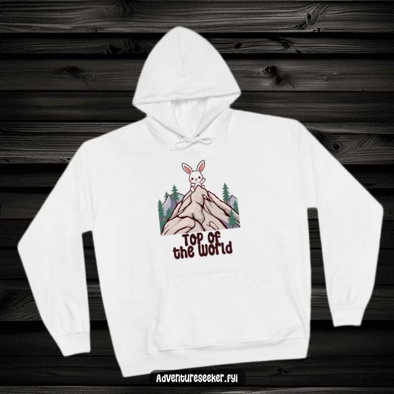 Funny climbing rabbit hoodie with a determined character reaching a mountain peak, offering warmth and motivational humor.