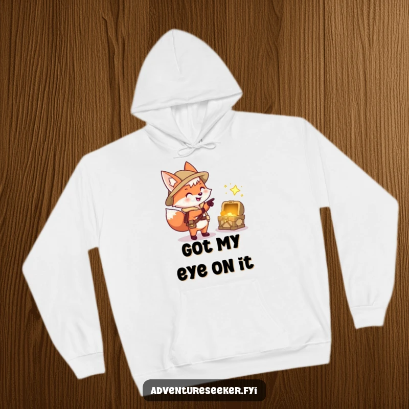 Funny hoodie featuring a happy fox explorer character pointing excitedly at a sparkling treasure chest, perfect for chilly adventures.