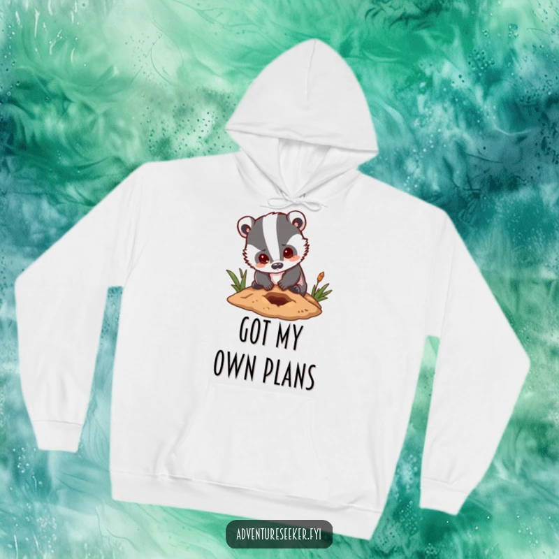 Funny badger hoodie featuring a focused character digging a small hole with a hopeful and determined expression, perfect for cold days.