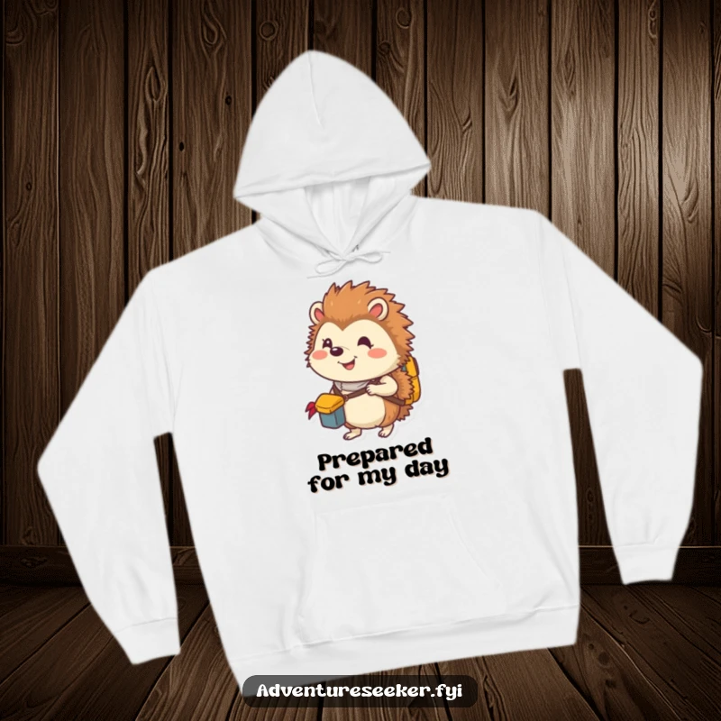 Funny hoodie with a smiling hedgehog explorer packing a tiny backpack, perfect for staying warm and ready for adventure.