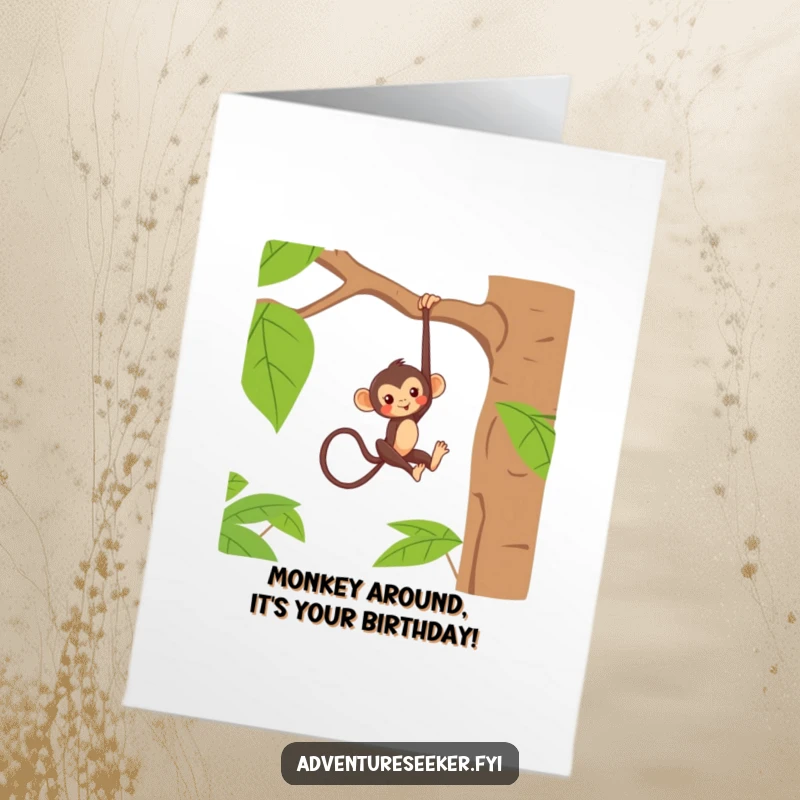Funny Free Printable Birthday Card: Mischievous monkey playfully hanging upside down from a jungle tree branch.