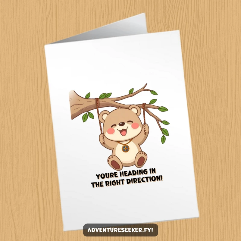 Funny Free Printable Congratulations Card: Bear cub with compass necklace, swinging, celebrating a path found.