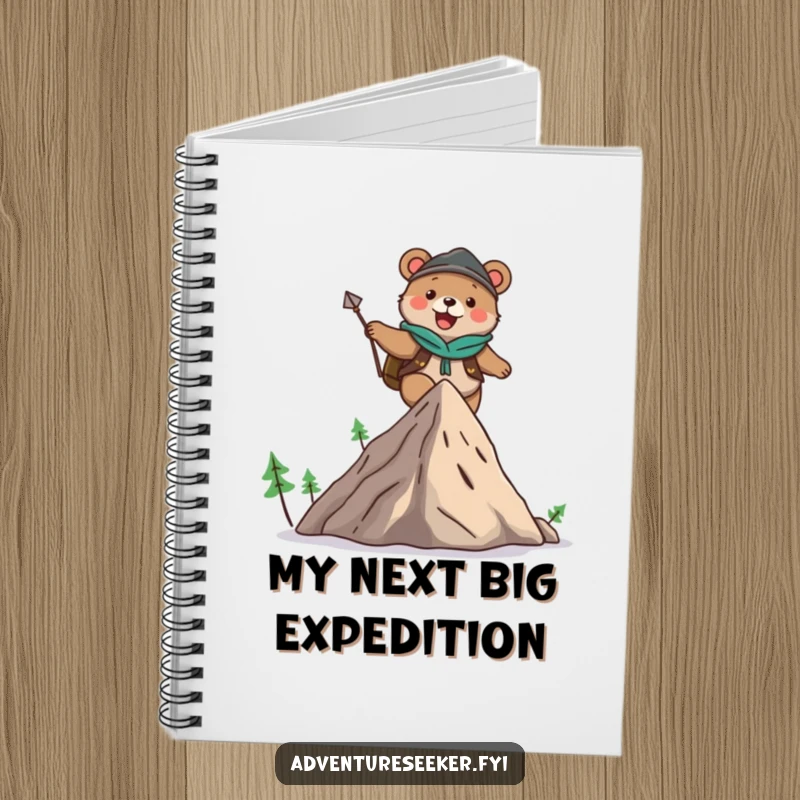 Funny notebook featuring a cute bear adventurer character joyfully climbing a mountain, ideal for notes and sketches.