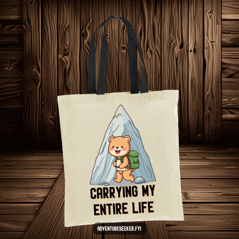 Funny tote bag illustrating a happy bear with a backpack scaling a colossal mountain, ideal for carrying essentials with a smile.