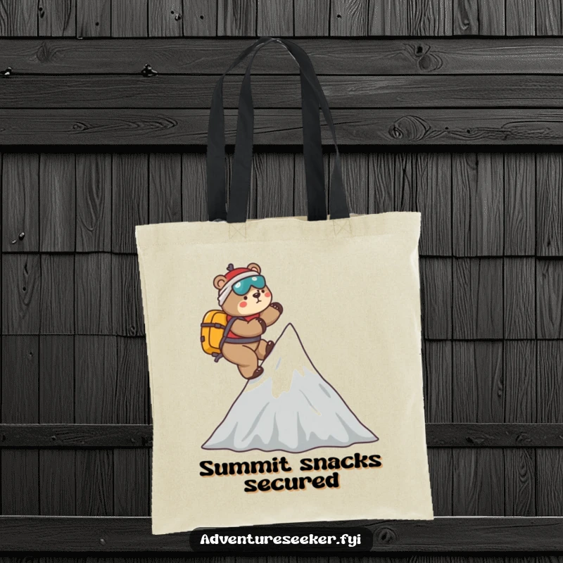 Funny Bear Mountaineer Tote Bag: Playful bear climbing a stylized mountain peak, perfect for carrying essentials with a humorous, adventurous flair.